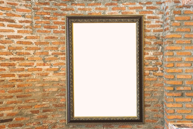 Blank photo vintage frame on the old brick wall