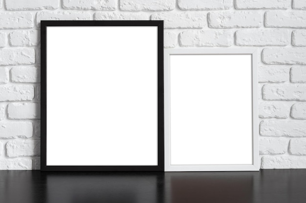 Blank picture frame against brick wall with copy space