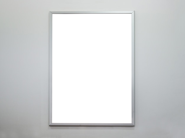 Blank poster frame on concrete wall