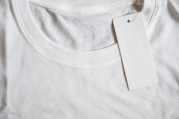 Blank price tag label on white t-shirt