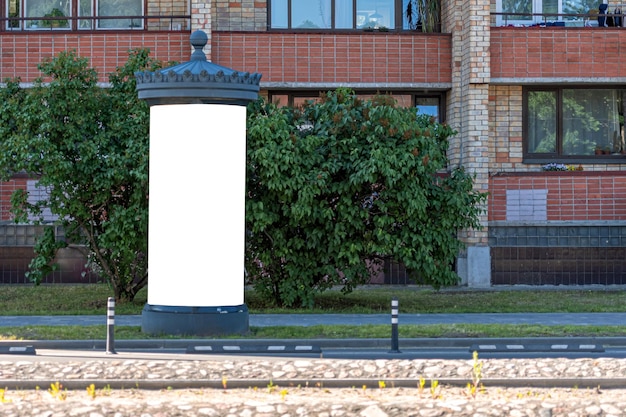 Blank public information board mockup on the side of the street near a residential building