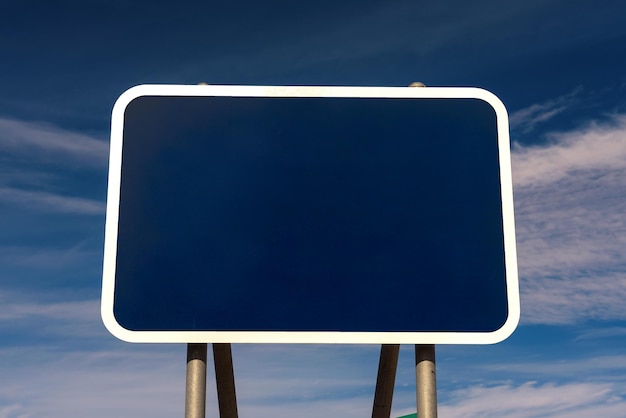 Blank road sign with blue background