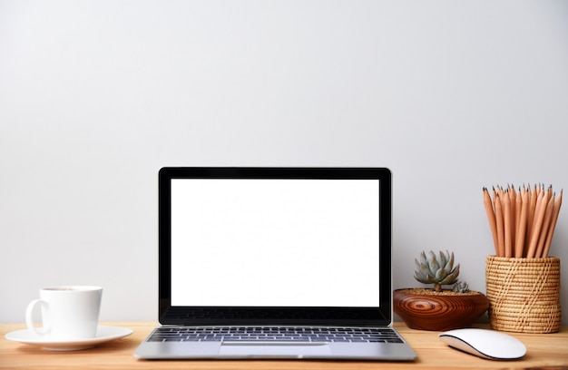 blank screen Modern laptop computer with mouse,Smart phone and Succulent on wood table in office view backgrounds