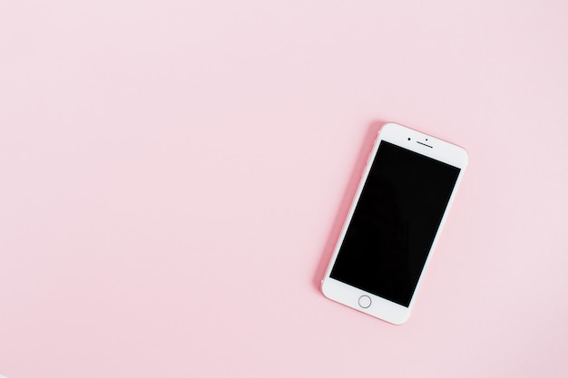 Blank screen smartphone isolated on pink background