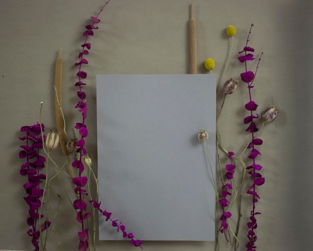 a blank sheet of paper against a background of flowers