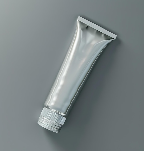 Blank silver cosmetic tube mockup on gray background