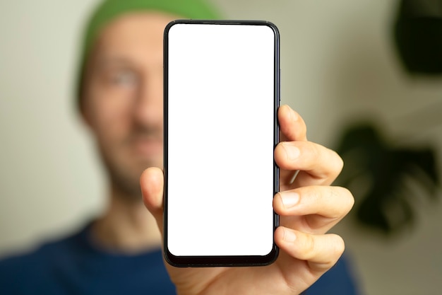 Blank smartphone screen in the hands