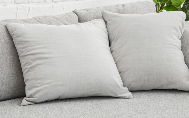 Photo blank soft pillow on cozy couch