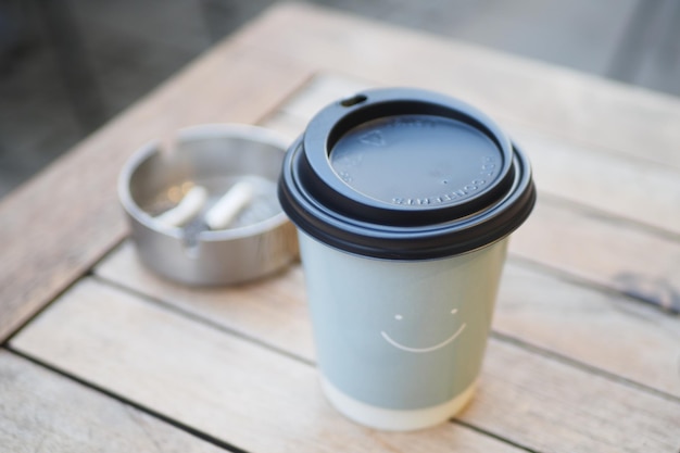 Blank take away kraft coffee cup on table