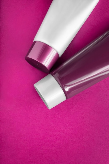 Blank tubes on pink background