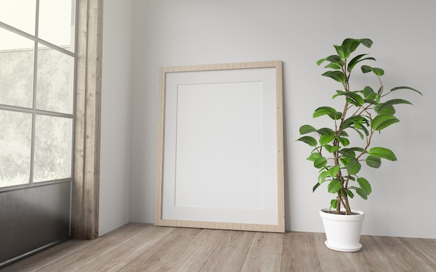 Blank vertical frame resting on the floor in a room with large windows. 