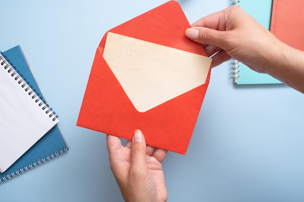 Blank Vitage sheet of paper woman hands take from the envelope Business mock up concept