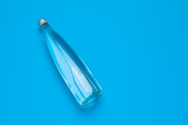 Blank water bottle on blue 