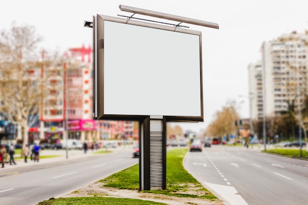 Blank white advertising board in empty street