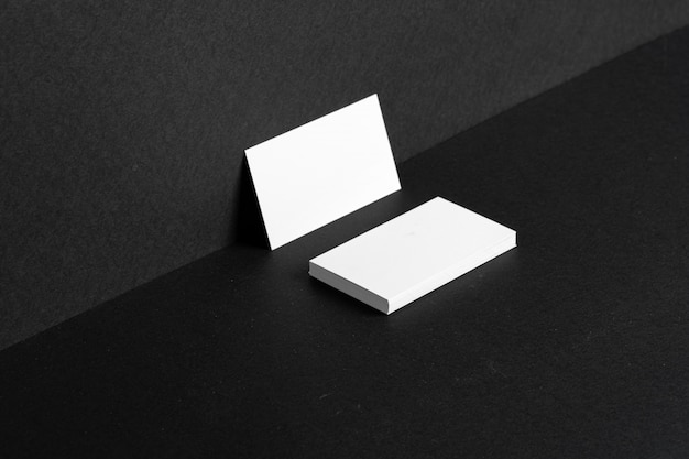 Blank white business cards leaning against the wall