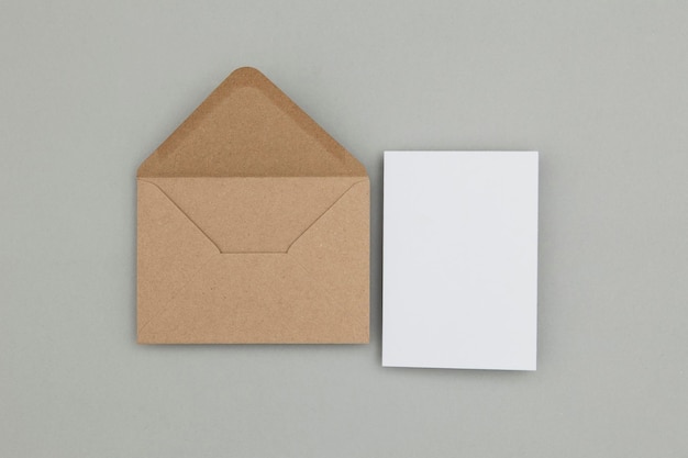 Blank white card with kraft brown paper envelope template mock up