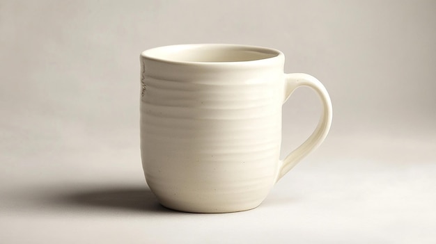 Photo blank white ceramic mug on a wooden table