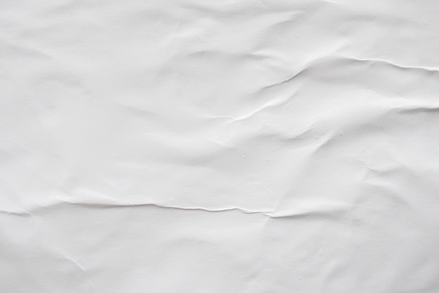 Blank white crumpled and creased paper poster texture background