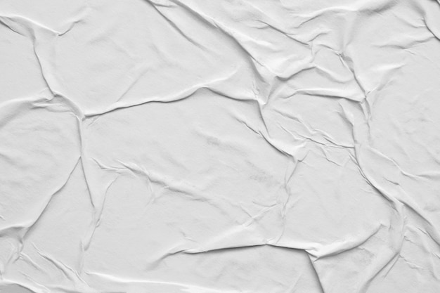 Blank white crumpled and creased paper poster texture background