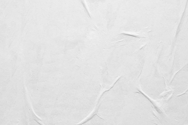 Blank white crumpled and creased paper poster texture background