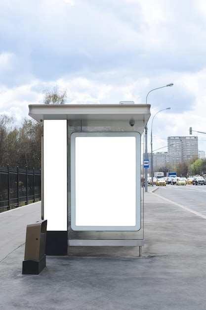 Blank white mock up in a bus stop in a city background