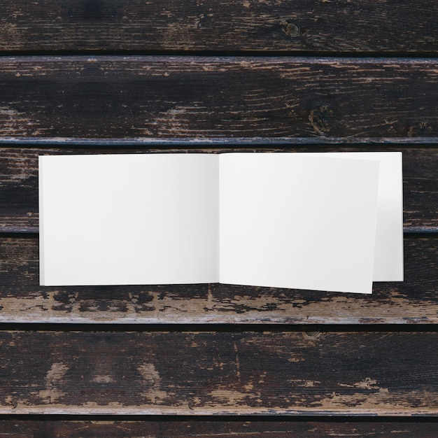 Blank white paper isolated on wooden