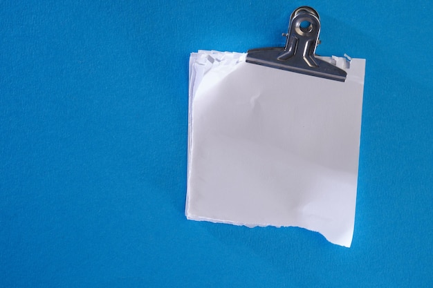 Blank white paper with metal clip