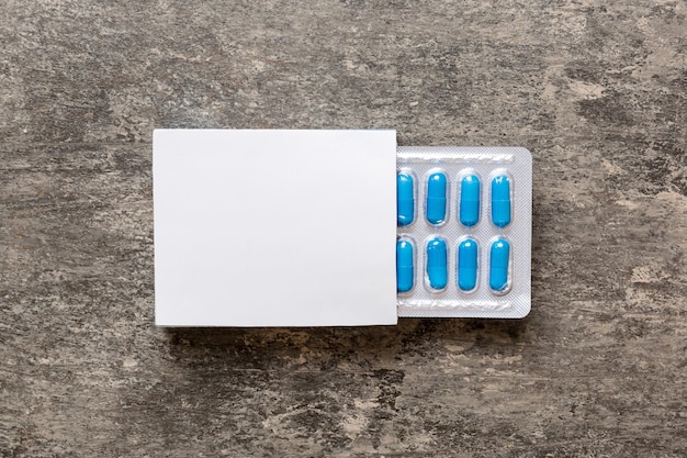 Photo blank white product package box mockup open blank medicine drug box with blister top view