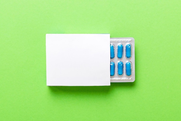 Blank White Product Package Box Mockup Open blank medicine drug box with blue pills blister top view