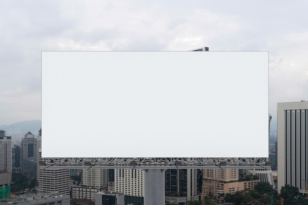 Blank white road billboard with KL cityscape background at day time Street advertising poster mock up 3D rendering Front view The concept of marketing communication to promote or sell idea