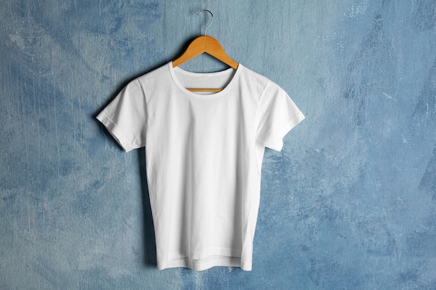 Blank white tshirt on grunge background