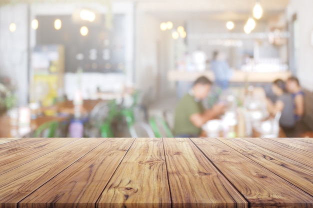 Blank Wood Table Top With people at restaurant or coffee cafe background for montage product