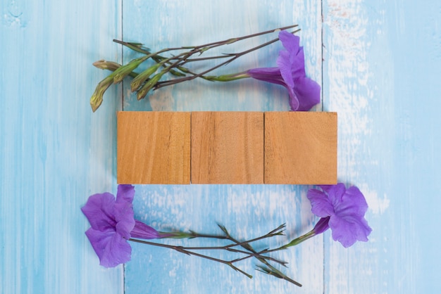 Blank wooden cube block with purple flower