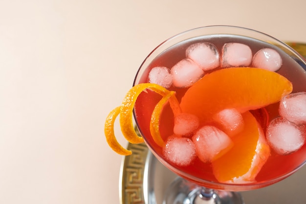 Blend of cocktails in glasses with orange peel