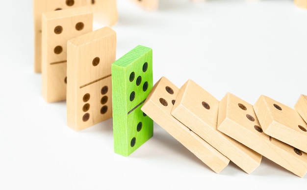 Block prevents other domino blocks from falling