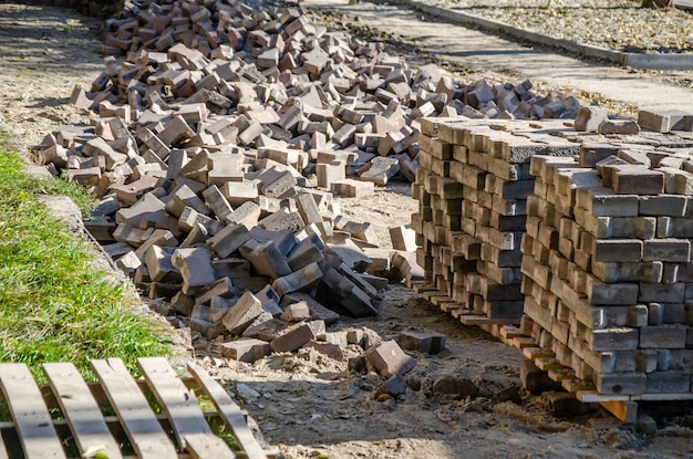 Blocks with paving slabs. Pavement repair and laying. Pile of paving stones for pavement repair