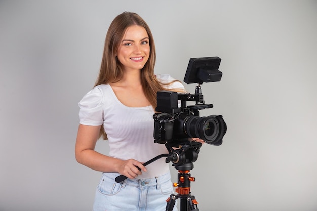 Blond Brazilian woman with cinema camera in her hand