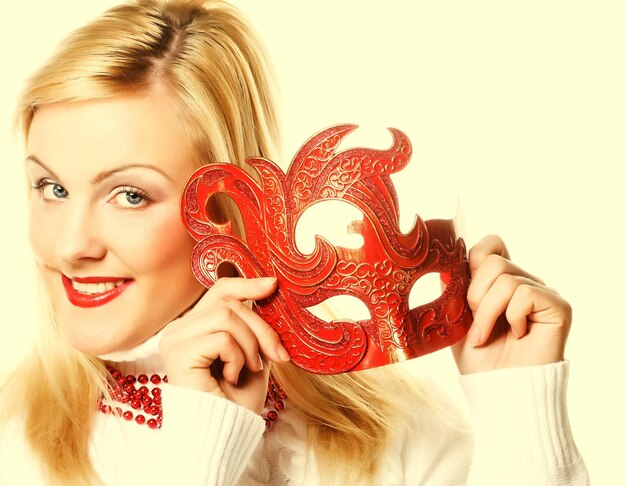 Blond girl with red mask