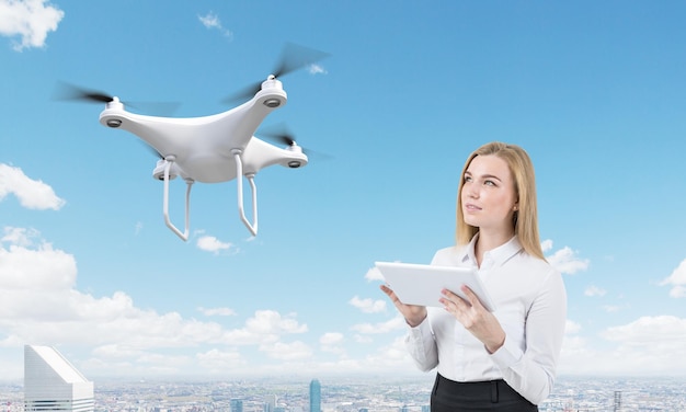 Blond woman controls a drone