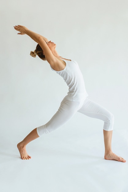 blonde beautiful cheerful woman doing yoga asanas Healthy lifestyle and sport concept