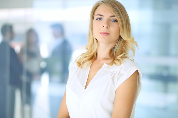 Blonde businesswoman looking at camera