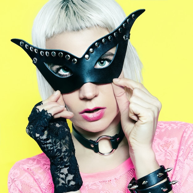 Blonde in fashion accessories. Leather Mask and jewelery