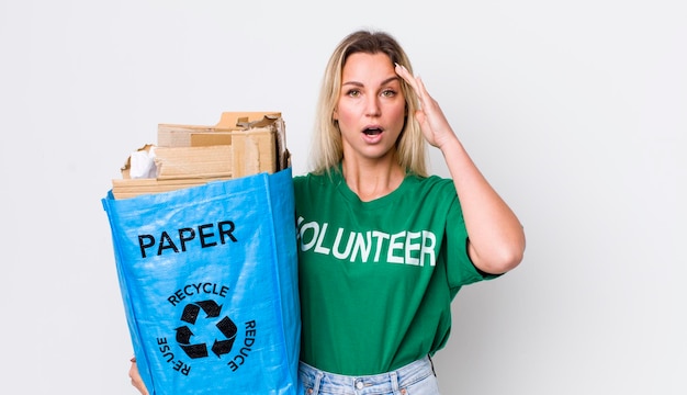 Blonde pretty woman looking happy astonished and surprised recycle concept