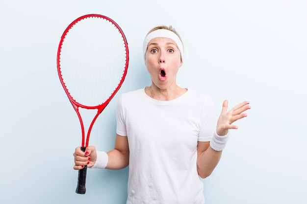 Blonde pretty woman practicing tennis sport