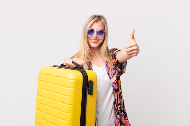 Blonde pretty woman with a suitcase. summer concept