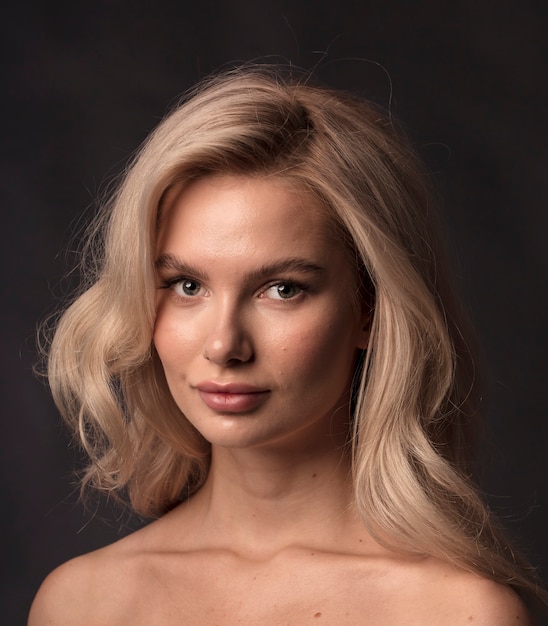 Blonde, studio portrait of a young girl