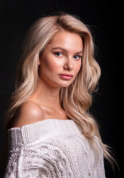 Blonde, studio portrait of a young girl