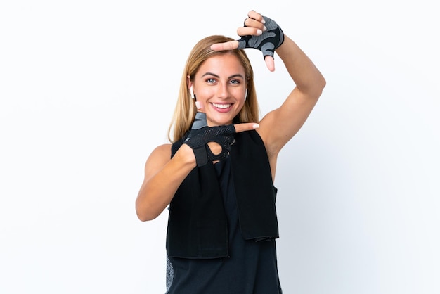 Blonde Uruguayan sport girl isolated on white background focusing face Framing symbol