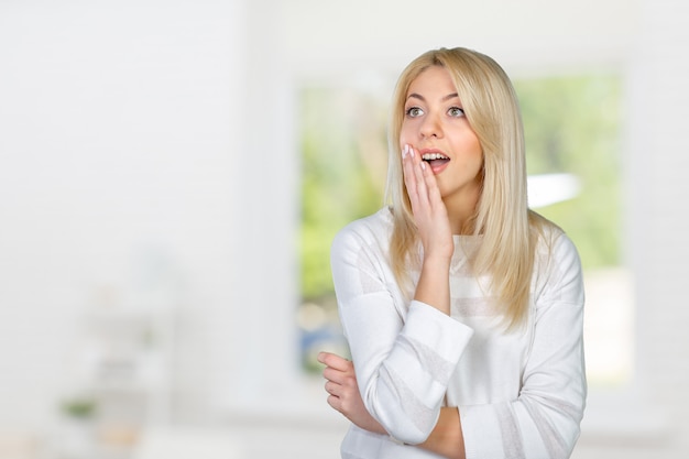 Blonde woman acting surprised and confused