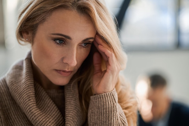 Blonde woman looking stressed and upset